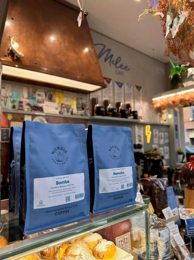 Melee cafe inside, with a focus on coffee bags