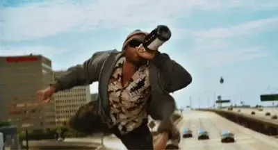Screen grab from the movie Hancock, where Will Smith plays a washed up amnesiac & alcoholic super hero. Image shows him flying above a highway wearing a dirty beanie, sunglasses and drinking from a bottle of whiskey