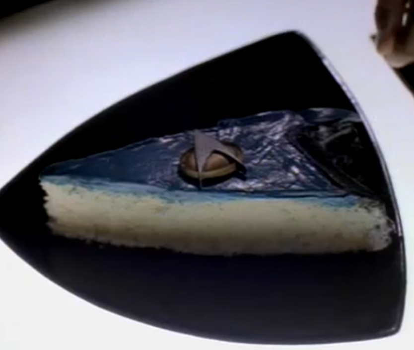 a slice of cellular peptide cake, with mint frosting